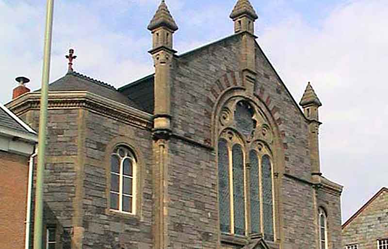 Extreior from ground level showing the three small roof turrets.