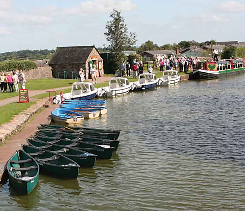 Rowing boats and canoes moored at the Wharf.
